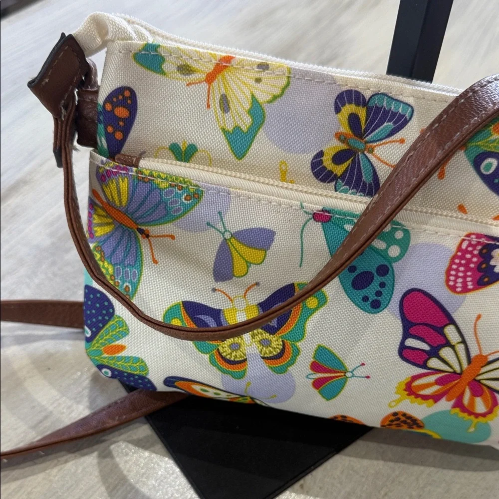 Lily Bloom Cream Crossbody Bag with Multicolor Butterfly Print and Brown Trim - Picture 7 of 12